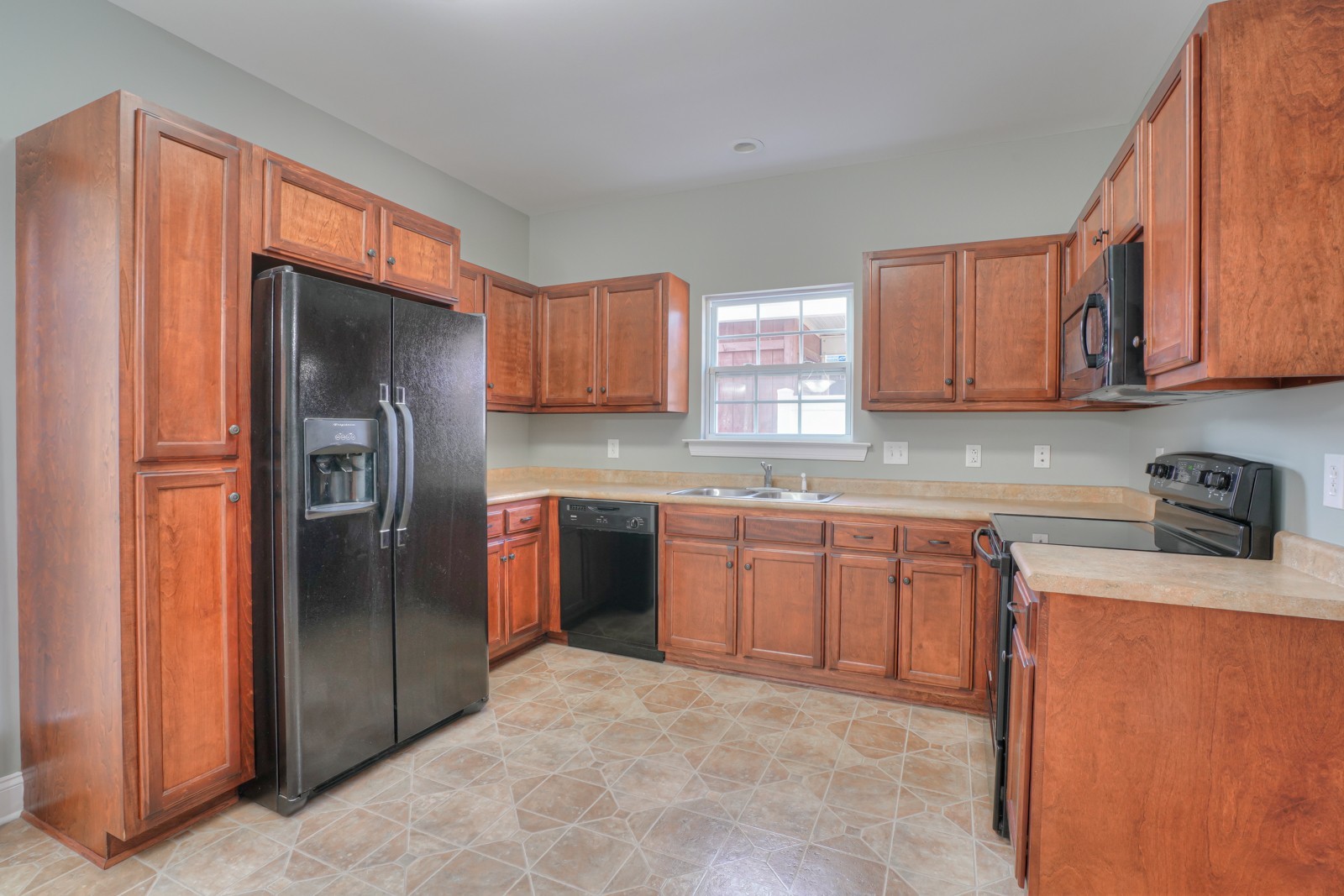 214 Rowlette Circle Murfreesboro, TN 37127 - Photo 9 of 27 a kitchen with stainless steel appliances granite countertop a refrigerator stove and sink