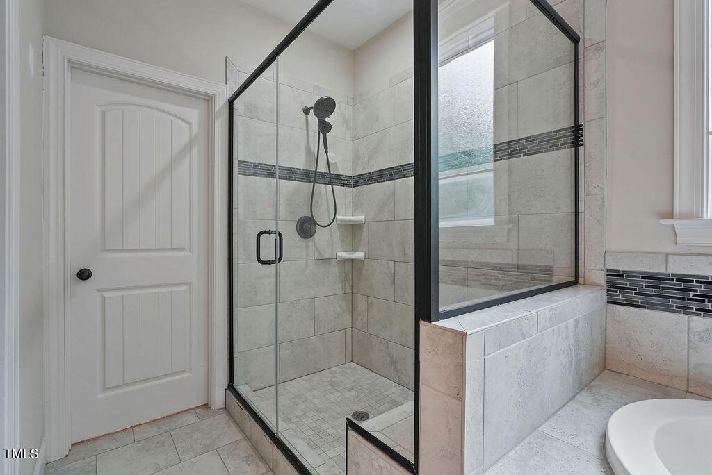 1124 Armsleigh Court Raleigh, NC 27603 - Photo 19 of 33 a bathroom with a shower and a sink