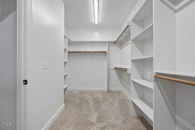 a view of an empty walk in closet