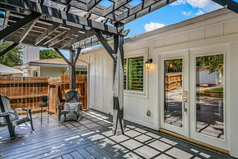 a kitchen with kitchen island a sink stainless steel appliances and cabinets