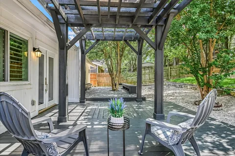 a view of living room and wooden deck