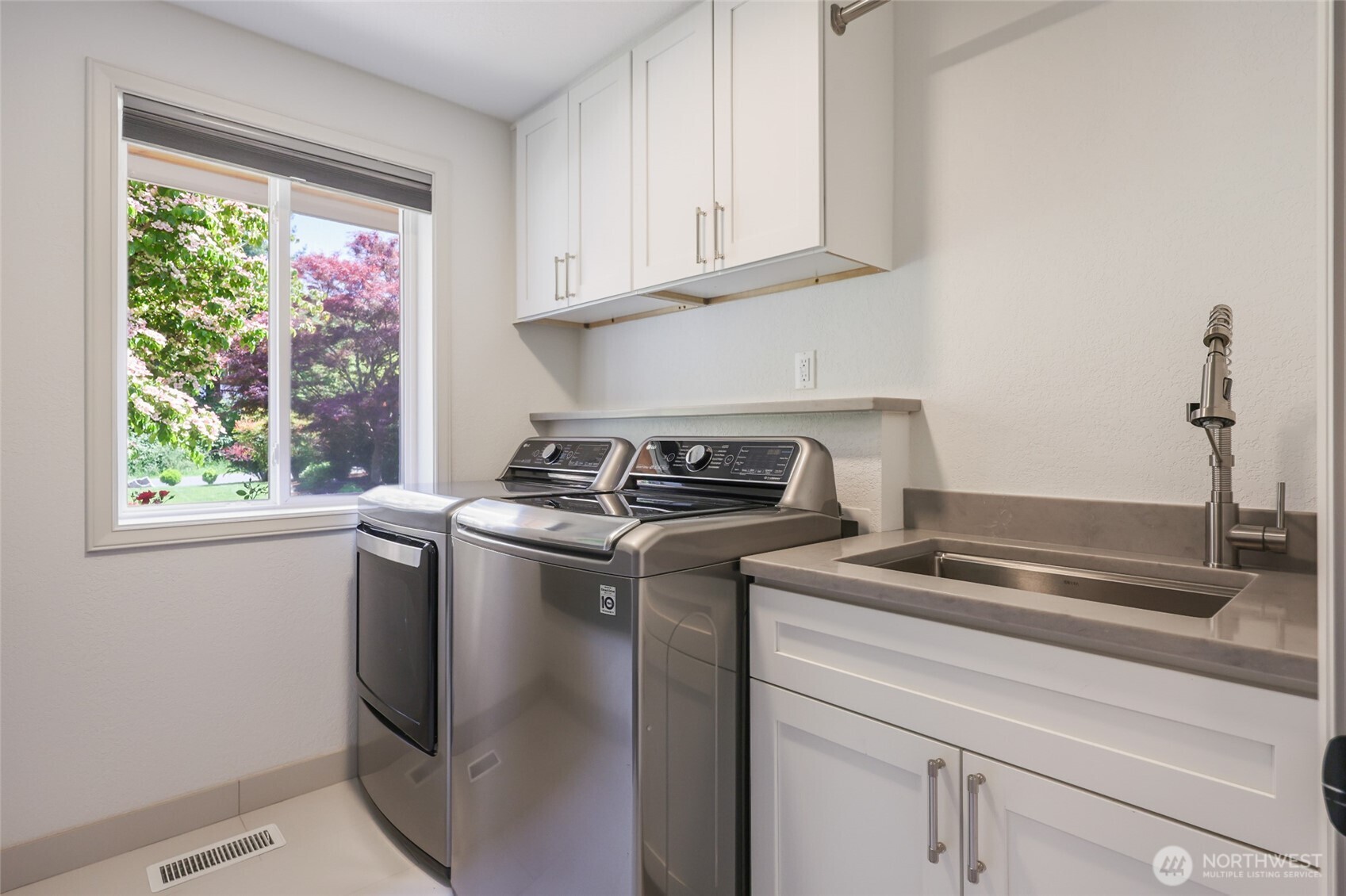 7713 78th Loop Northwest Olympia, WA 98502 - Photo 28 of 40 a white stove top oven sitting inside of a kitchen