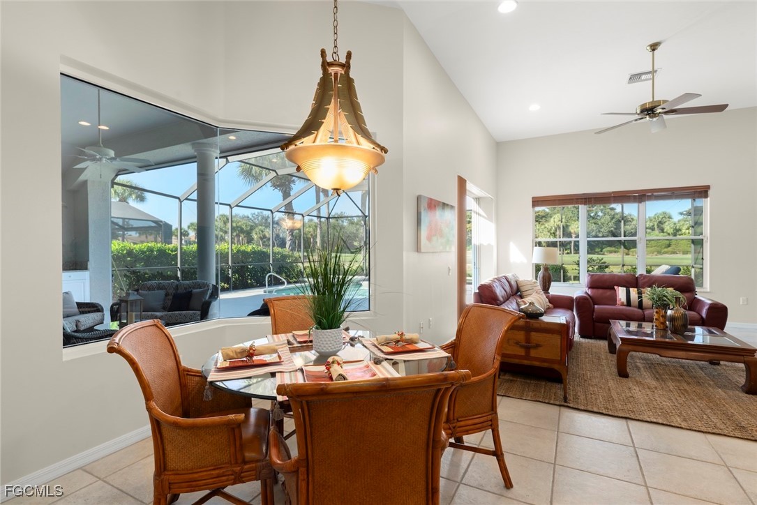 23180 Whispering Ridge Drive Estero, FL 34135 - Photo 13 of 42 a view of a dining room with furniture window and outside view