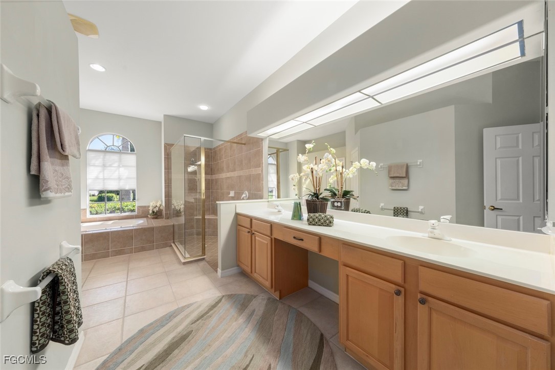 23180 Whispering Ridge Drive Estero, FL 34135 - Photo 24 of 42 a large white kitchen with a large window