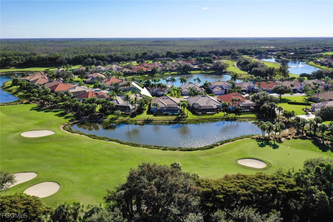 23180 Whispering Ridge Drive Estero, FL 34135 - Photo 3 of 42 an aerial view of a house with a swimming pool yard and outdoor seating