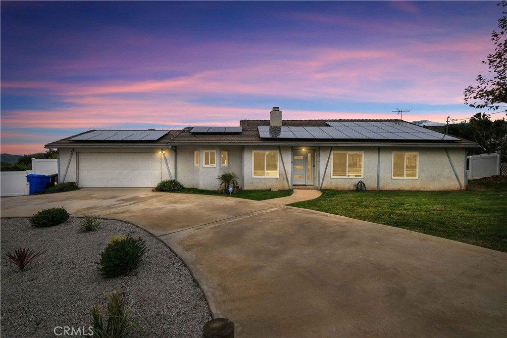 35716 Wildwood Canyon Road Yucaipa, CA 92399 - Photo 1 of 57 a front view of a house with a garden
