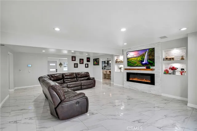 a view of a living room and a balcony
