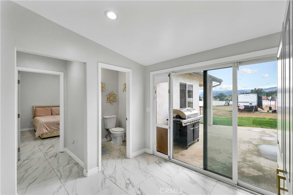 35716 Wildwood Canyon Road Yucaipa, CA 92399 - Photo 16 of 57 a view of a living room and a balcony