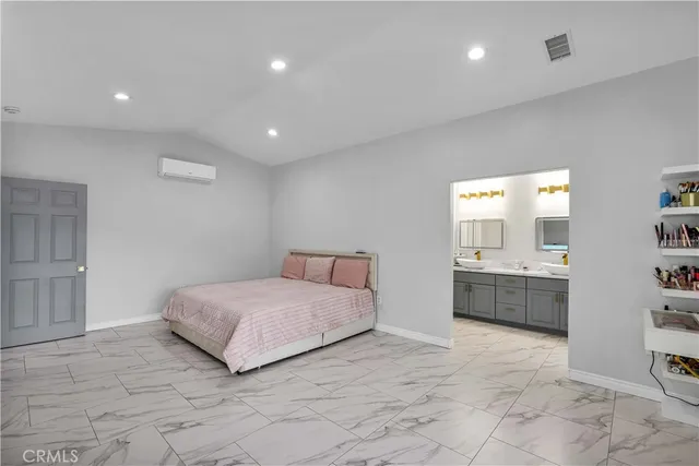 a bedroom with furniture and a wooden floor