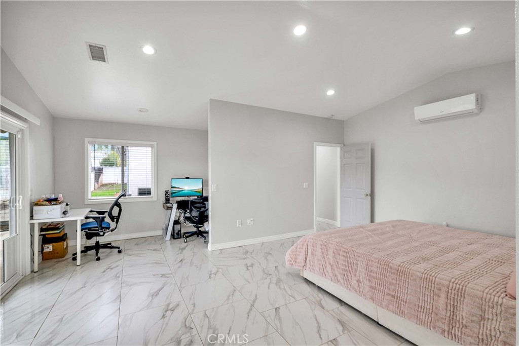 35716 Wildwood Canyon Road Yucaipa, CA 92399 - Photo 19 of 57 a bedroom with furniture and a wooden floor