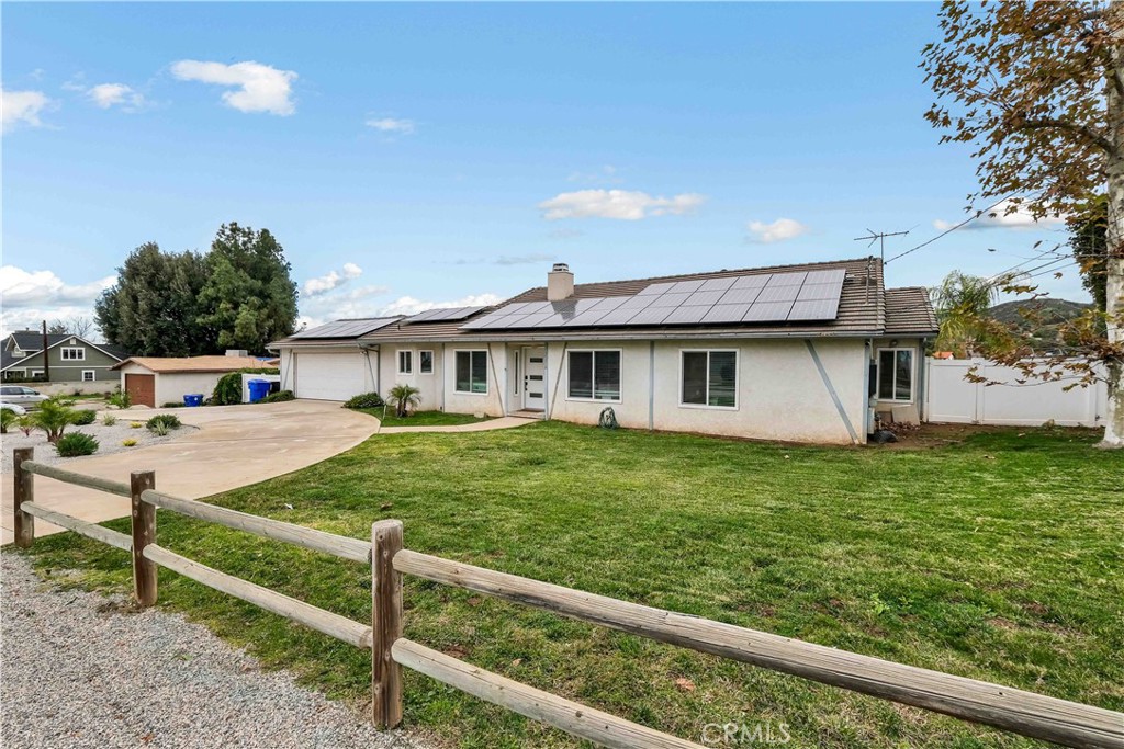 35716 Wildwood Canyon Road Yucaipa, CA 92399 - Photo 3 of 57 a front view of a house with garden