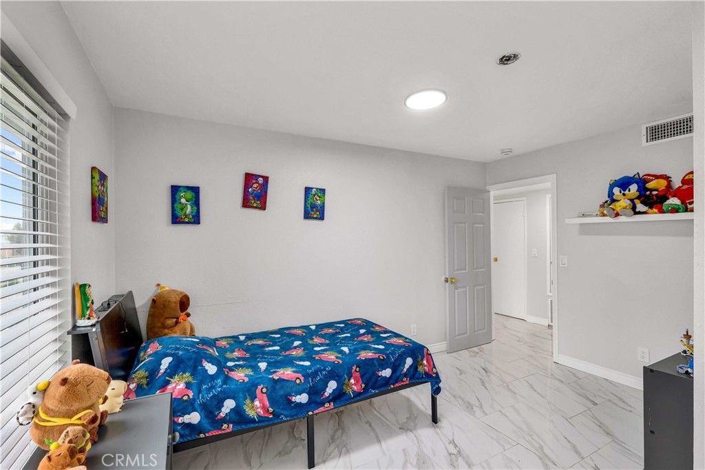 35716 Wildwood Canyon Road Yucaipa, CA 92399 - Photo 32 of 57 a bedroom with a bed and a window