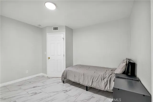a view of storage and utility room with washer and dryer