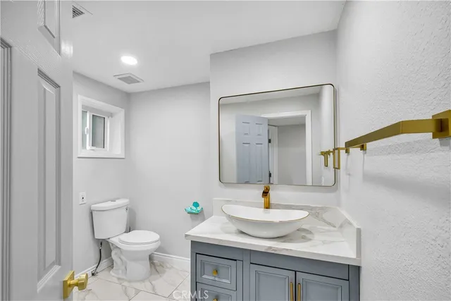 a view of a swimming pool and a back yard