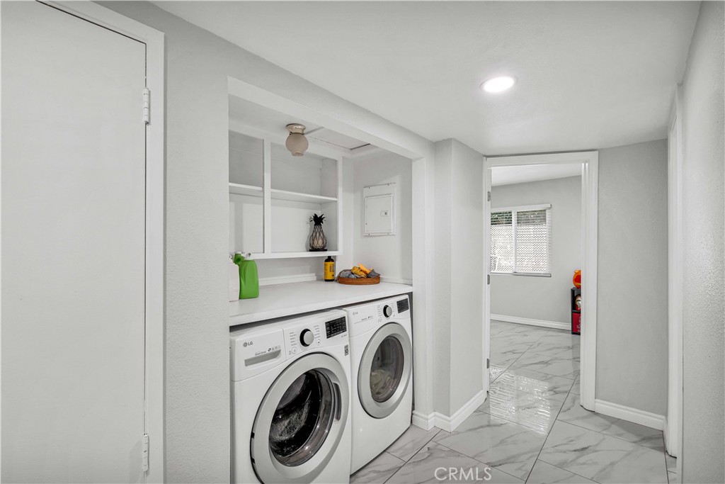 35716 Wildwood Canyon Road Yucaipa, CA 92399 - Photo 39 of 57 a view of storage and utility room with washer and dryer