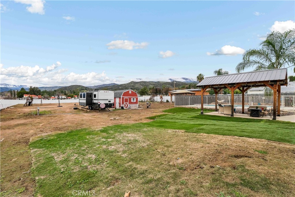 35716 Wildwood Canyon Road Yucaipa, CA 92399 - Photo 46 of 57 a view of a big yard with table and chairs