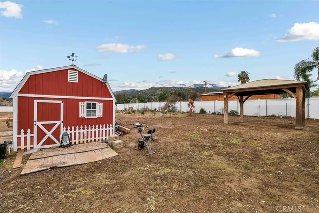 an aerial view of residential houses with outdoor space and river