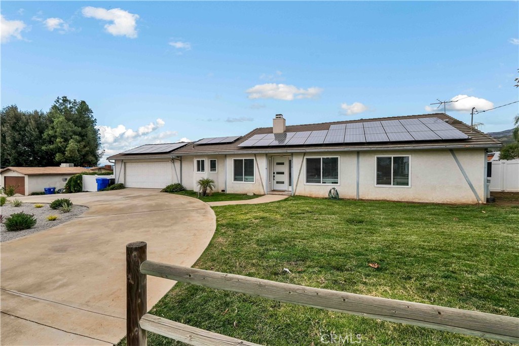 35716 Wildwood Canyon Road Yucaipa, CA 92399 - Photo 6 of 57 a front view of a house with garden