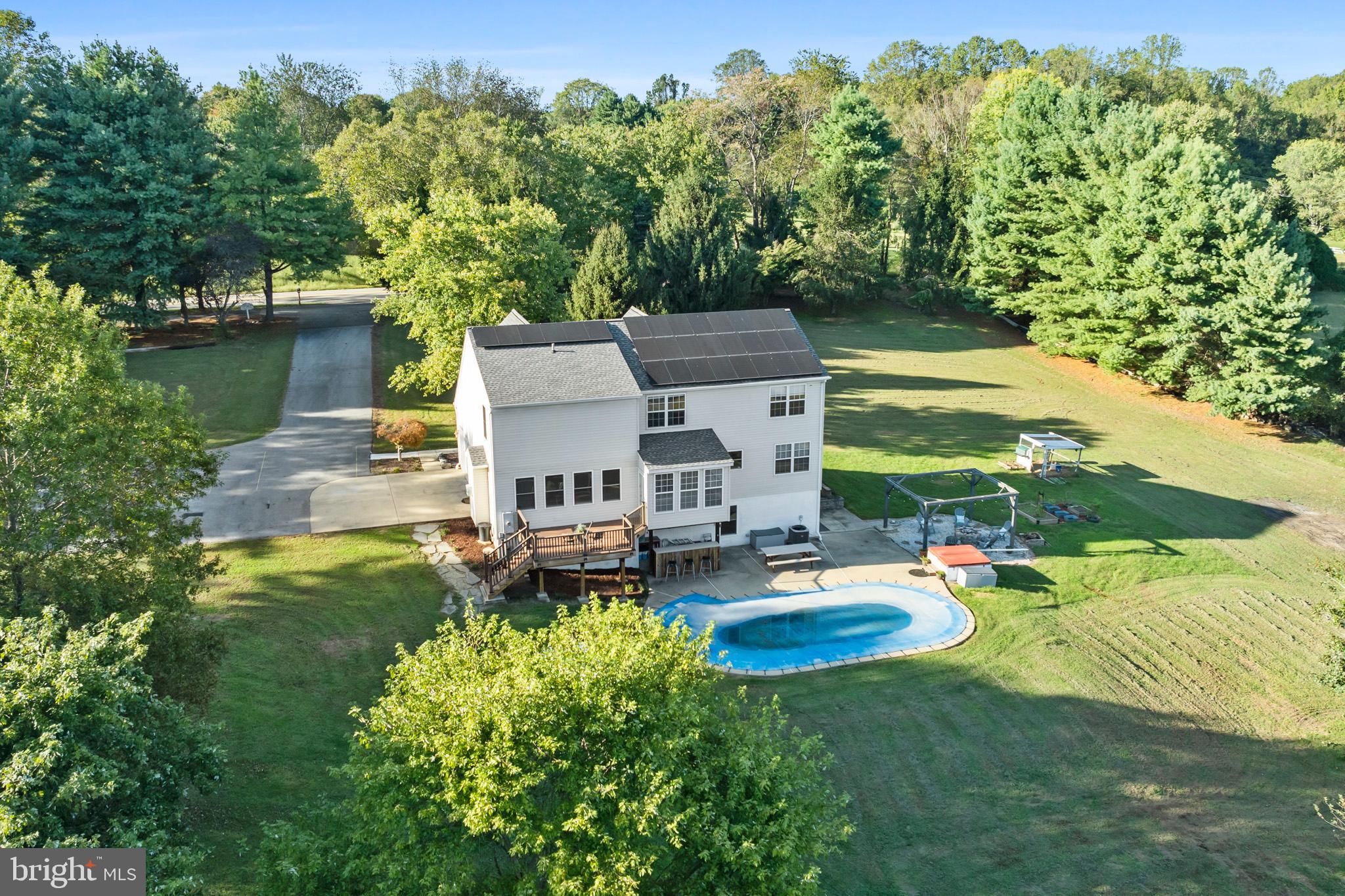 3446 Chaneyville Road Owings, MD 20736 - Photo 12 of 74 an aerial view of a house with outdoor space pool seating area and yard