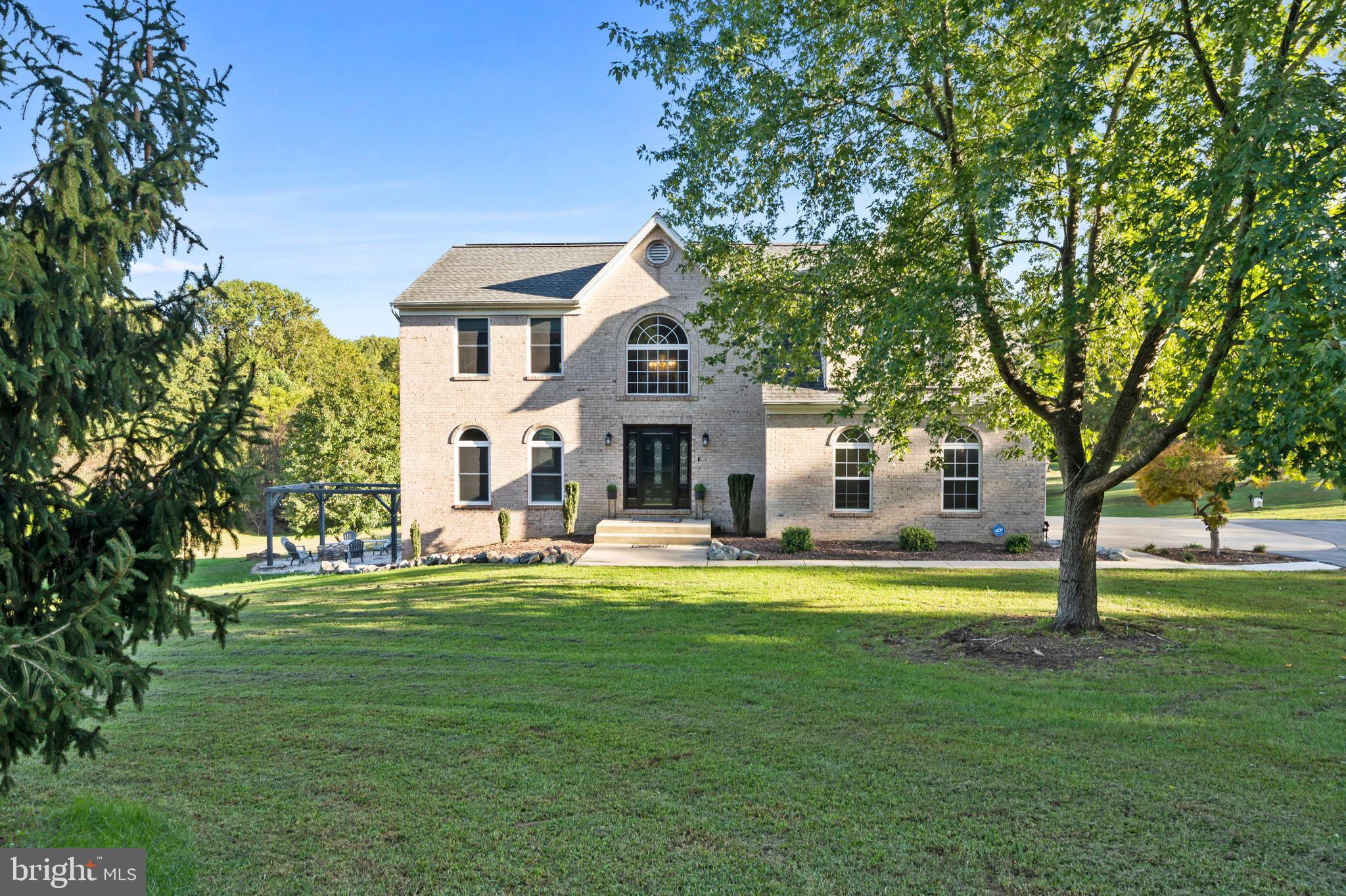 3446 Chaneyville Road Owings, MD 20736 - Photo 2 of 74 a front view of a house with a garden