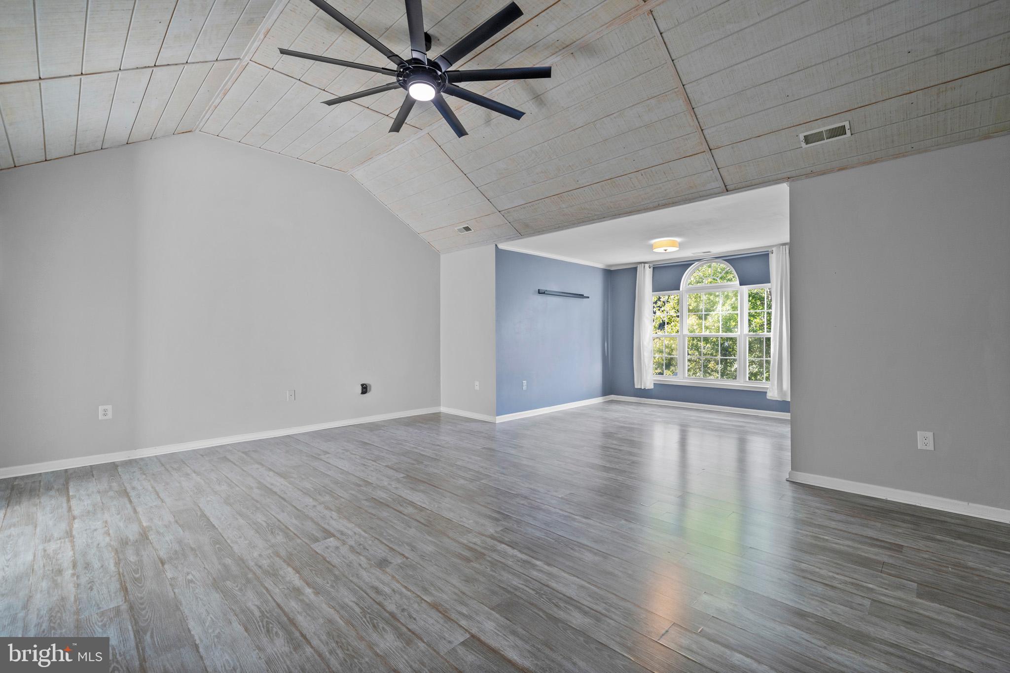 3446 Chaneyville Road Owings, MD 20736 - Photo 34 of 74 an empty room with wooden floor and windows