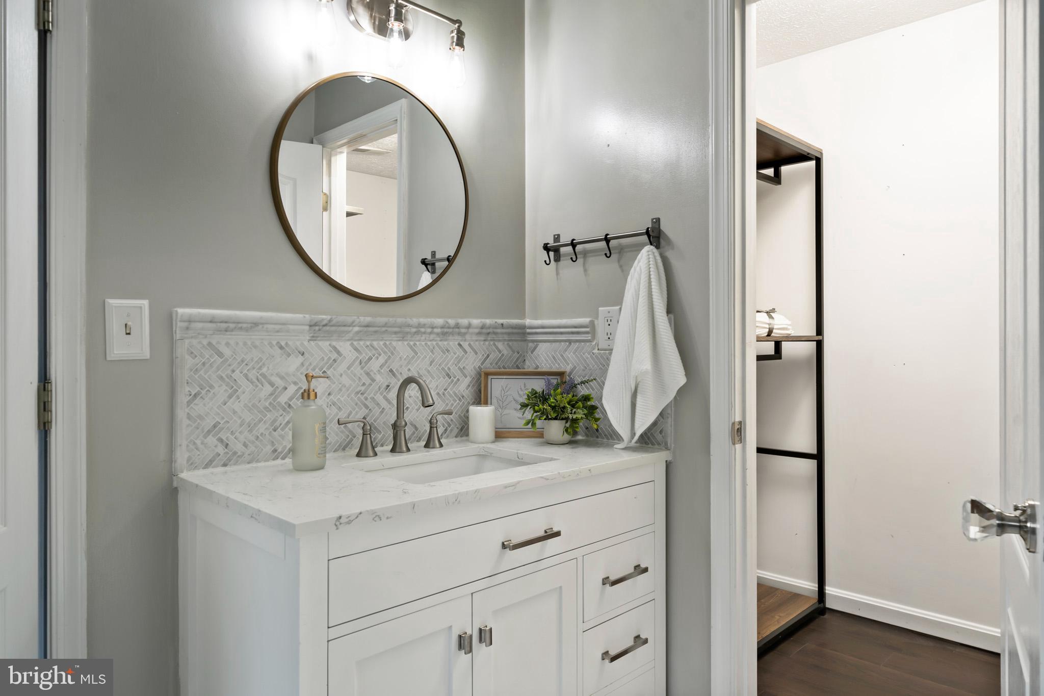 3446 Chaneyville Road Owings, MD 20736 - Photo 39 of 74 a bathroom with a sink and a mirror