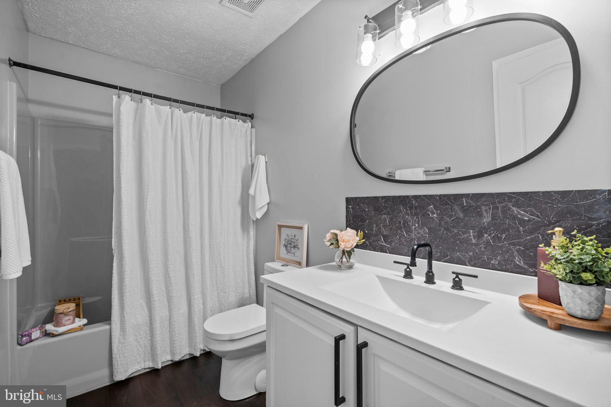 3446 Chaneyville Road Owings, MD 20736 - Photo 43 of 74 a bathroom with a sink a toilet and a mirror