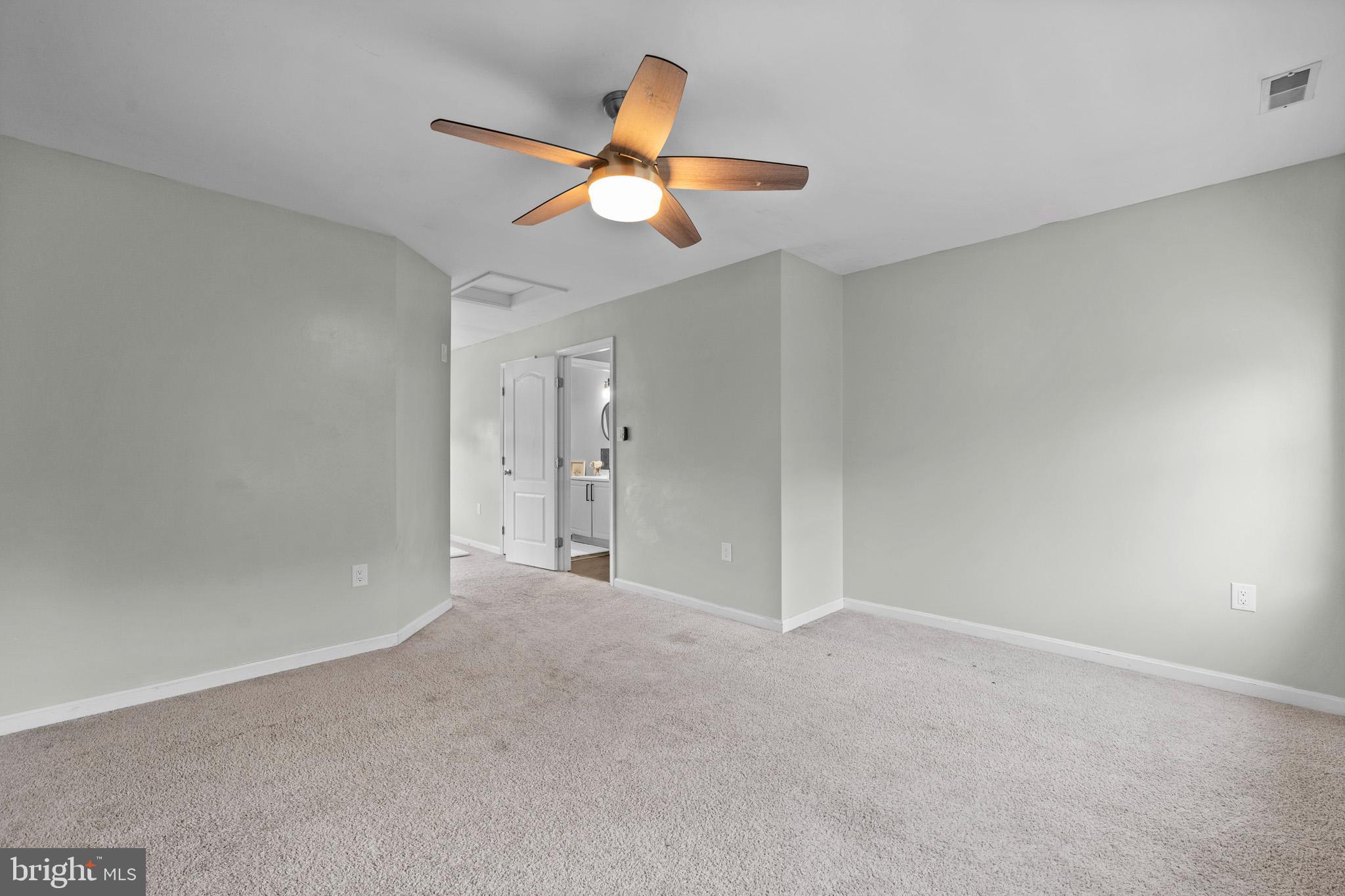 3446 Chaneyville Road Owings, MD 20736 - Photo 44 of 74 an empty room with closet and a chandelier fan
