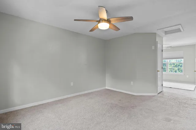 a view of chairs and table in the patio