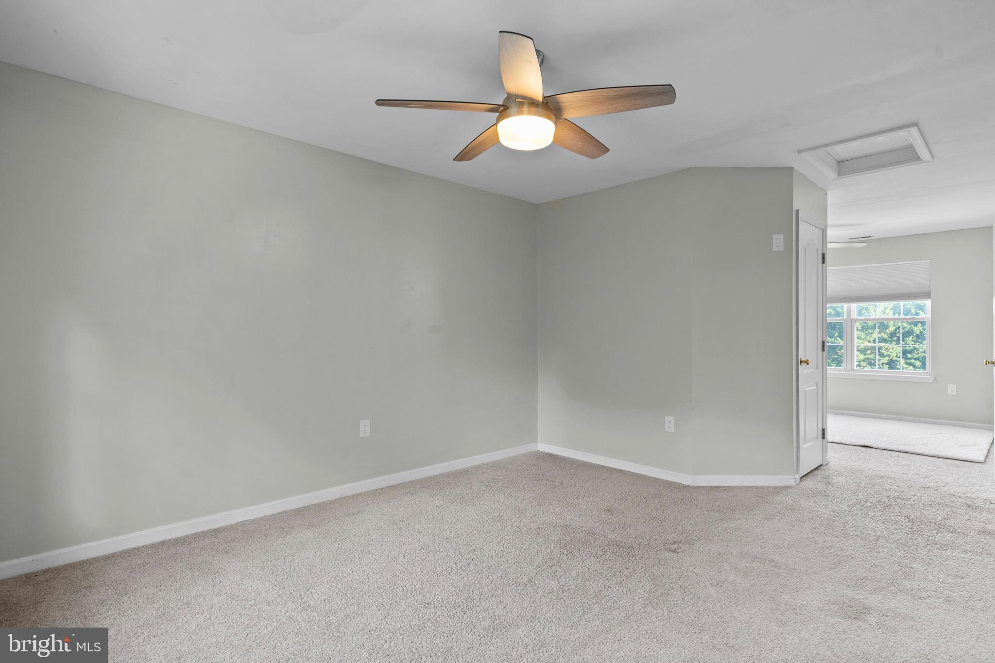 3446 Chaneyville Road Owings, MD 20736 - Photo 45 of 74 an empty room with a window and a fan