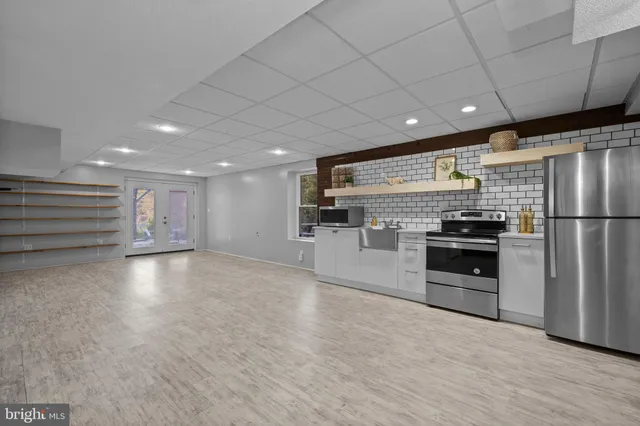 a view of a swimming pool and trees in the background