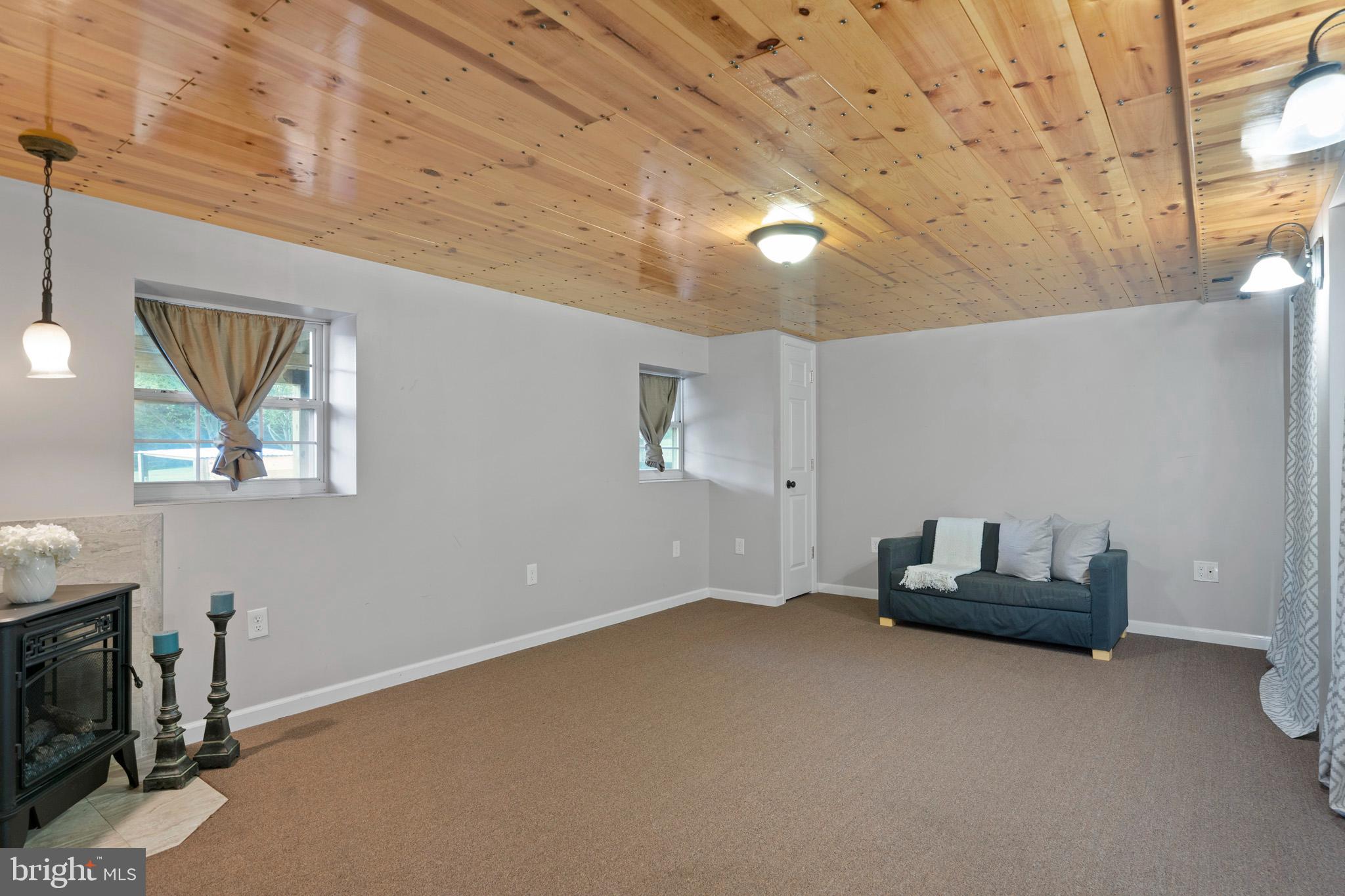 3446 Chaneyville Road Owings, MD 20736 - Photo 59 of 74 a living room with furniture and a fireplace