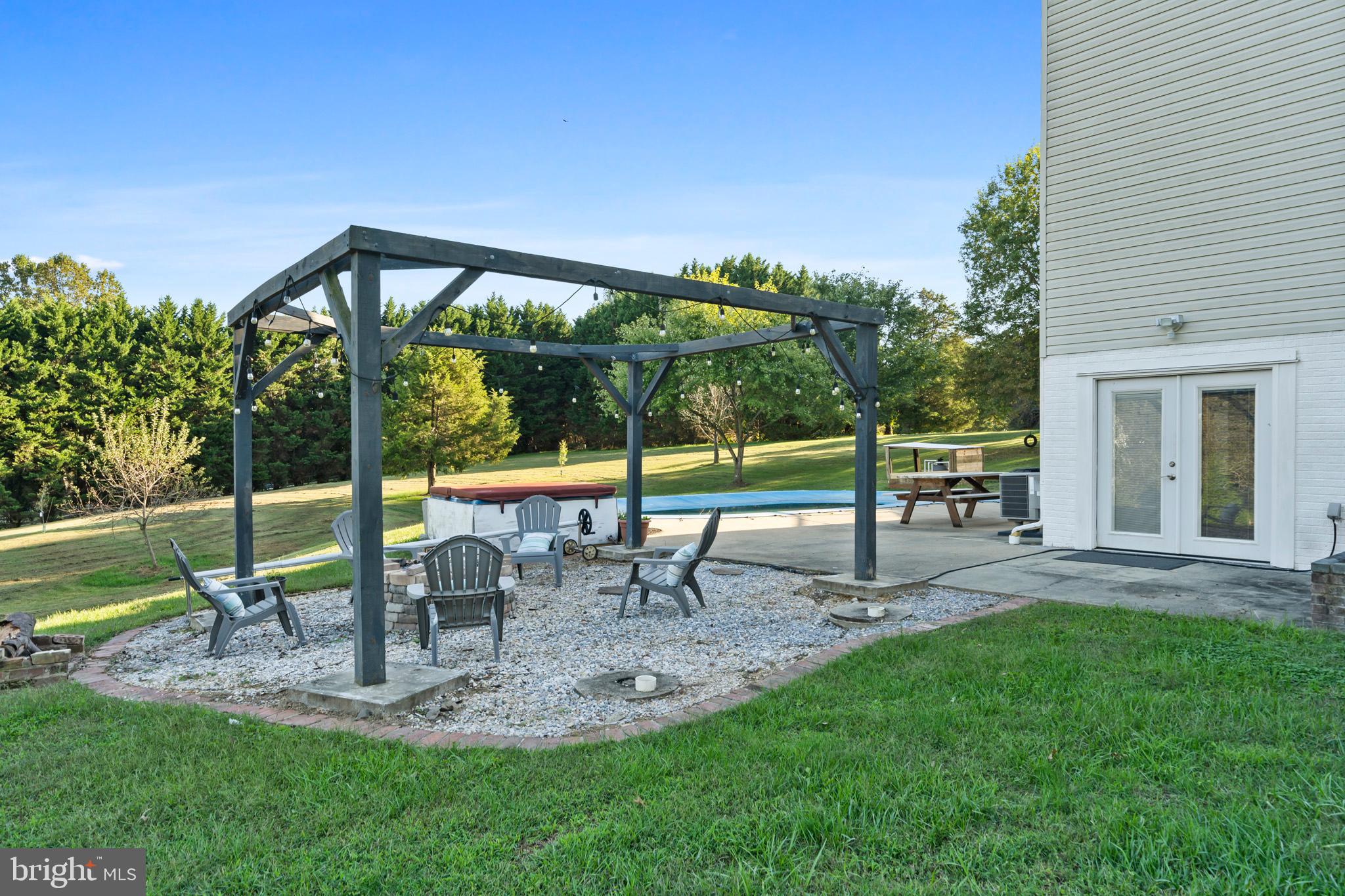 3446 Chaneyville Road Owings, MD 20736 - Photo 65 of 74 a view of a house with backyard and sitting area