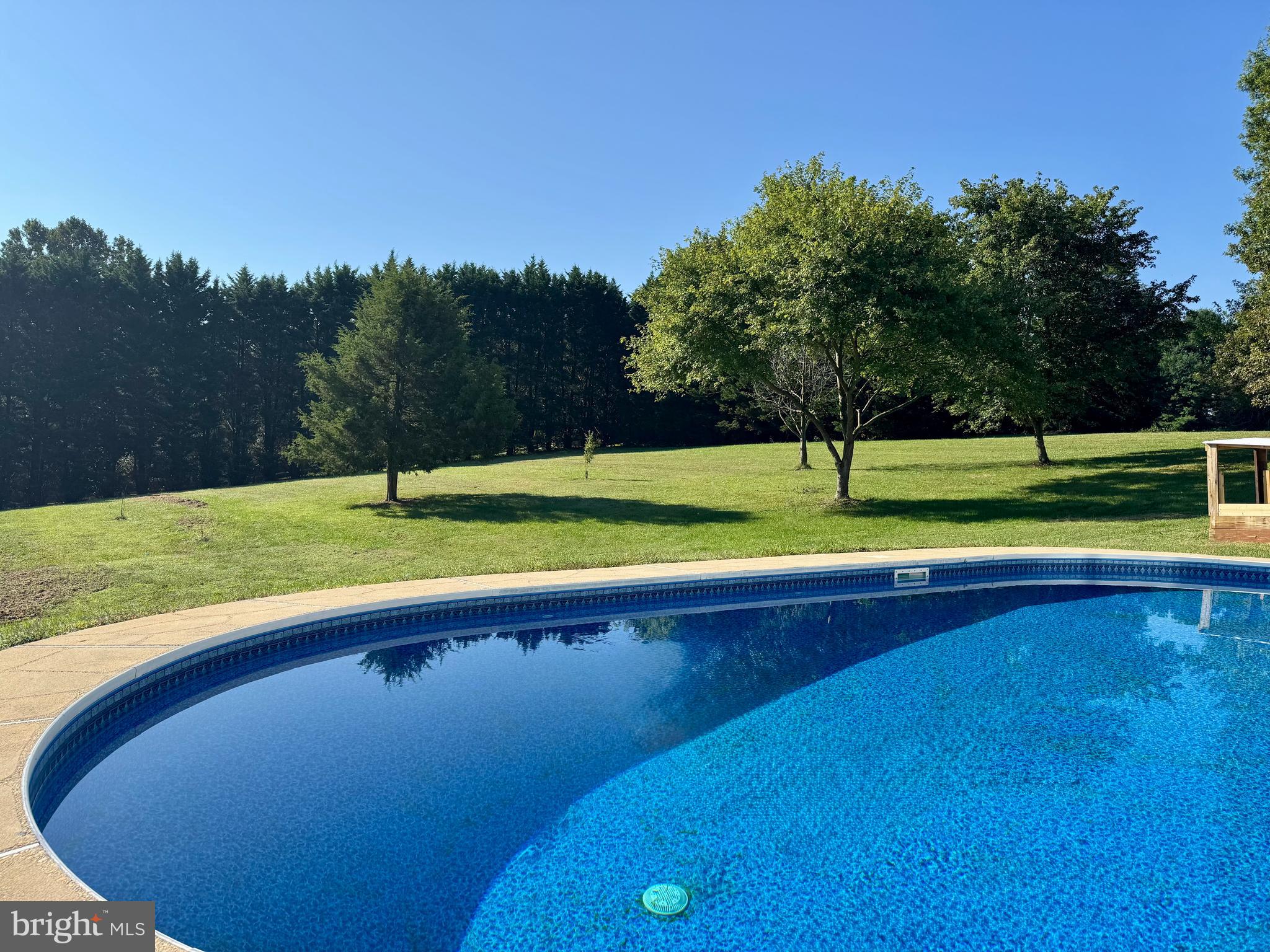 3446 Chaneyville Road Owings, MD 20736 - Photo 72 of 74 a view of a backyard with a swimming pool and outdoor space