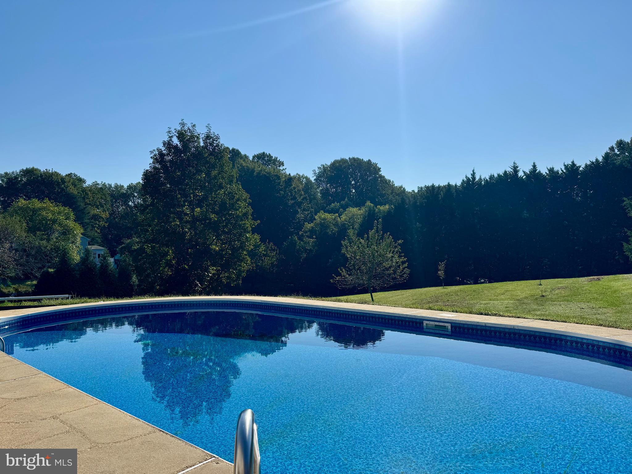 3446 Chaneyville Road Owings, MD 20736 - Photo 74 of 74 a view of a swimming pool and trees in the background