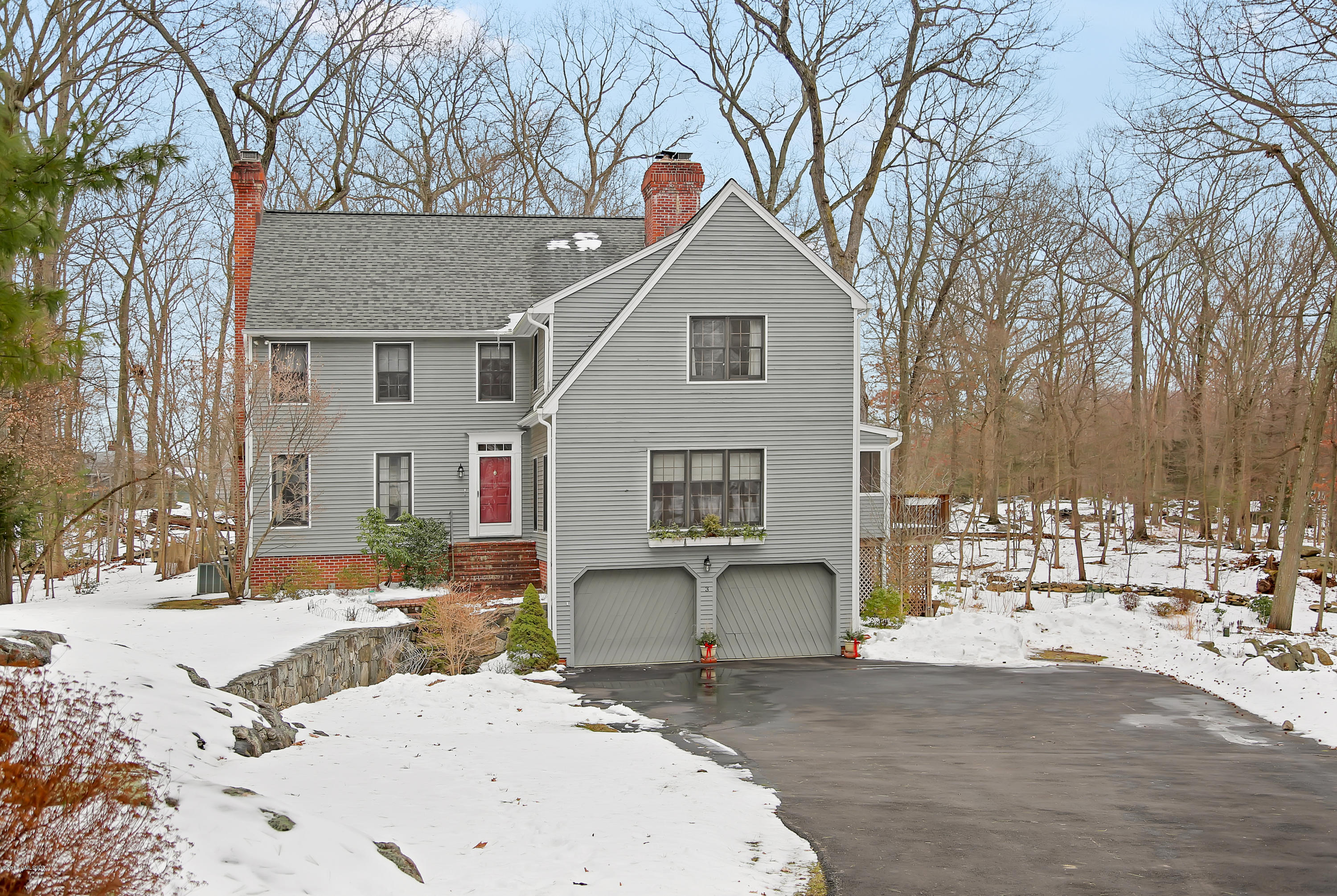 3 Arrowhead Lane Cos Cob, CT 06807 - Photo 1 of 1 a view of a white house with snow on the road