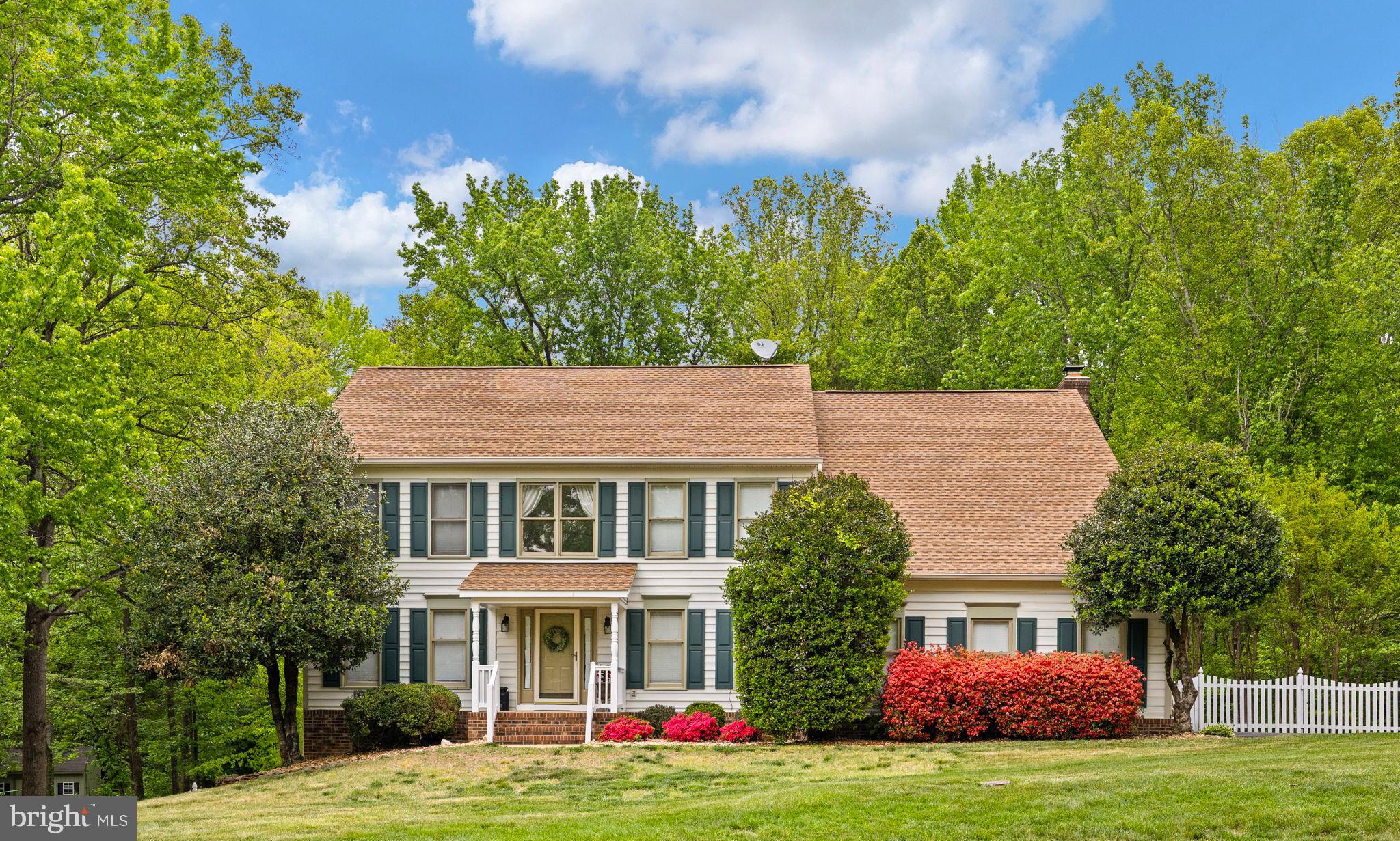 100 Boscobel Road Fredericksburg, VA 22405 - Photo 16 of 67 a front view of a house with a garden