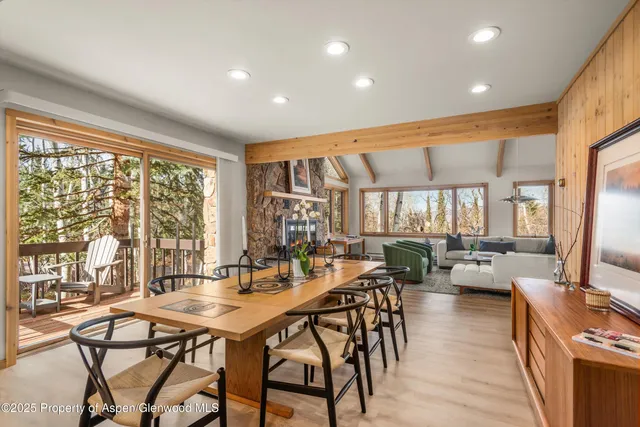 a front view of a house with a yard and an trees