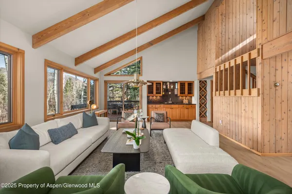 a kitchen with stainless steel appliances a stove a sink and a refrigerator