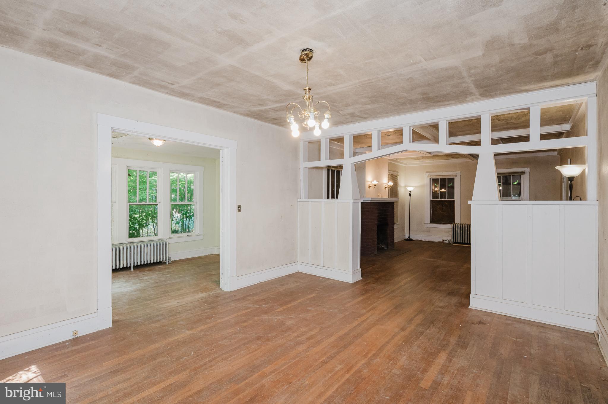 103 Sherwood Road Cockeysville, MD 21030 - Photo 12 of 59 a view of a big room with wooden floor a chandelier and windows