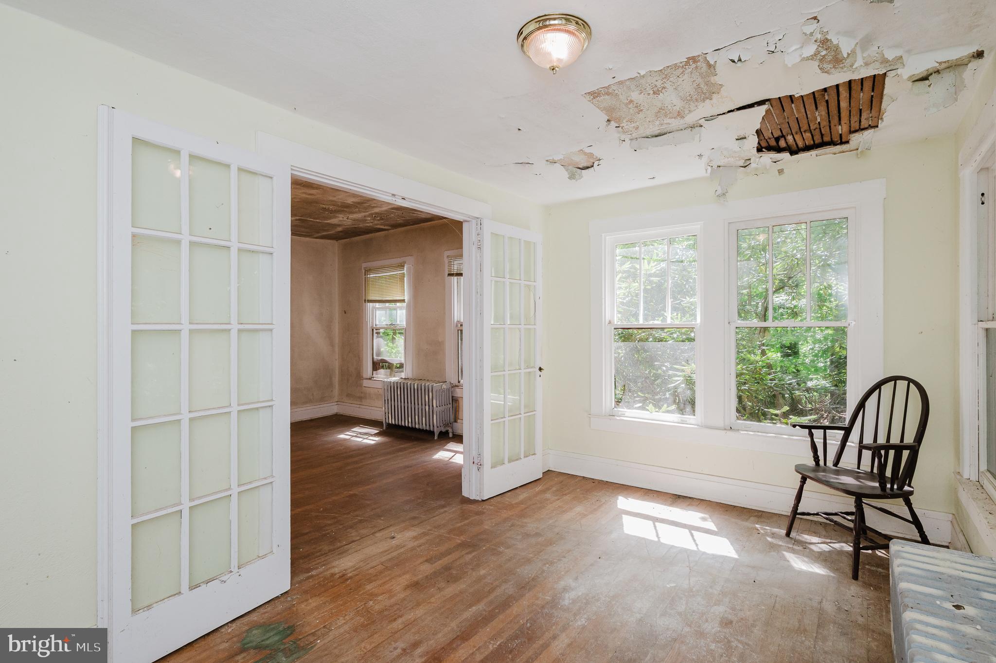 103 Sherwood Road Cockeysville, MD 21030 - Photo 20 of 59 a view of empty room with wooden floor and windows