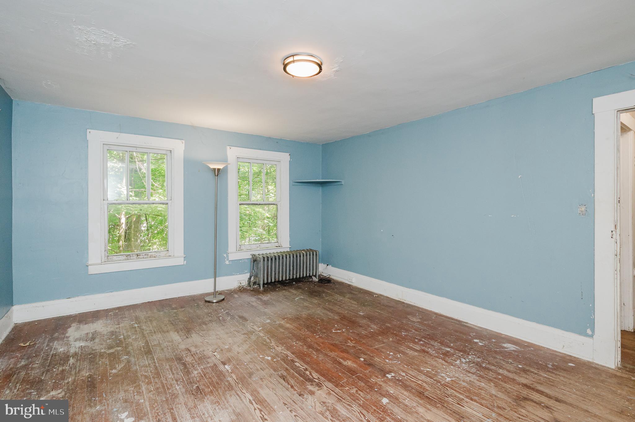 103 Sherwood Road Cockeysville, MD 21030 - Photo 23 of 59 an empty room with wooden floor and windows