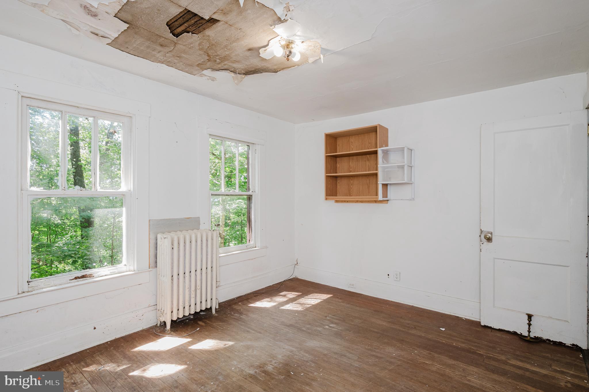 103 Sherwood Road Cockeysville, MD 21030 - Photo 25 of 59 a view of empty room with wooden floor and fan