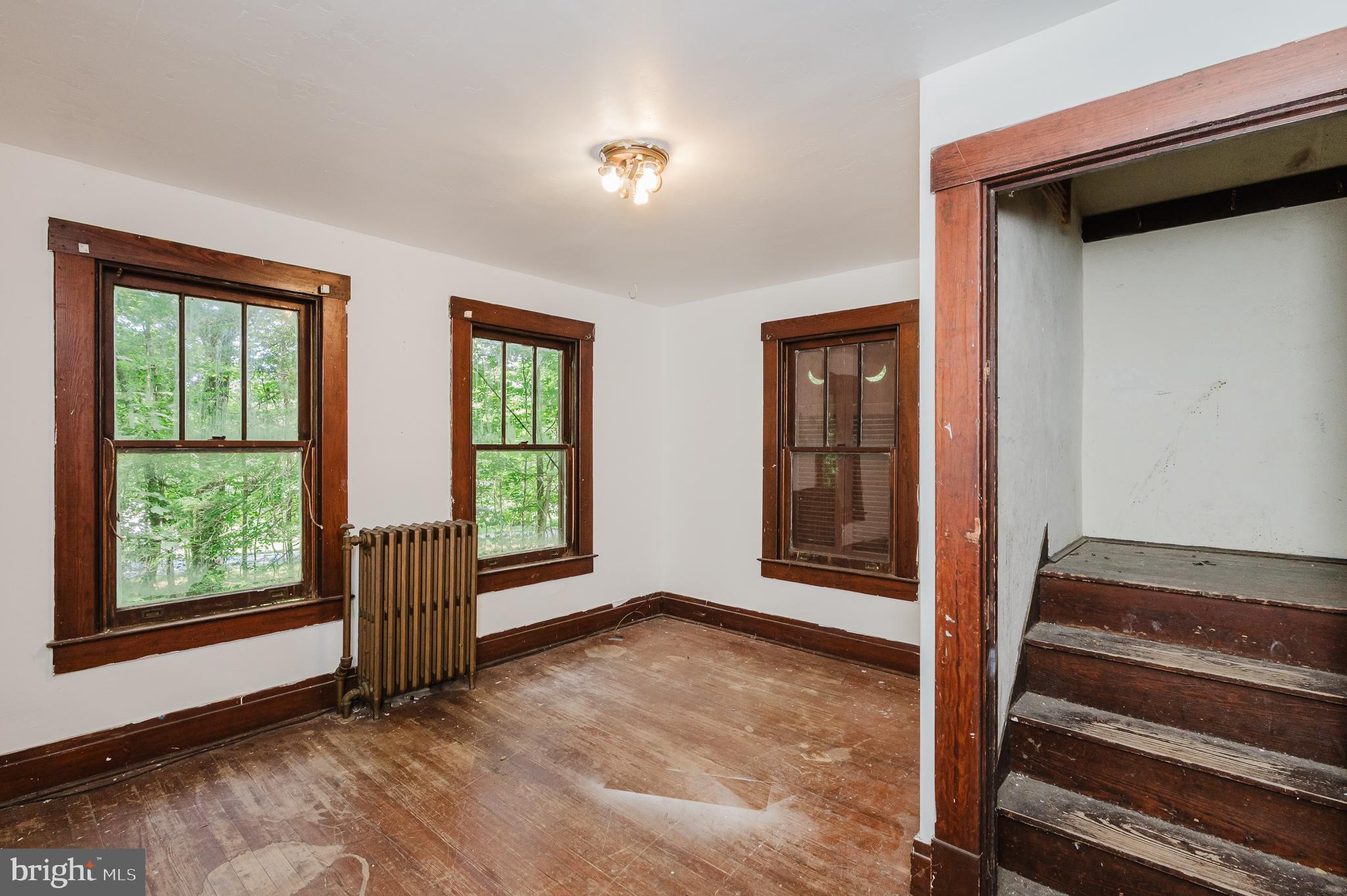 103 Sherwood Road Cockeysville, MD 21030 - Photo 35 of 59 a view of an empty room with wooden floor and a window