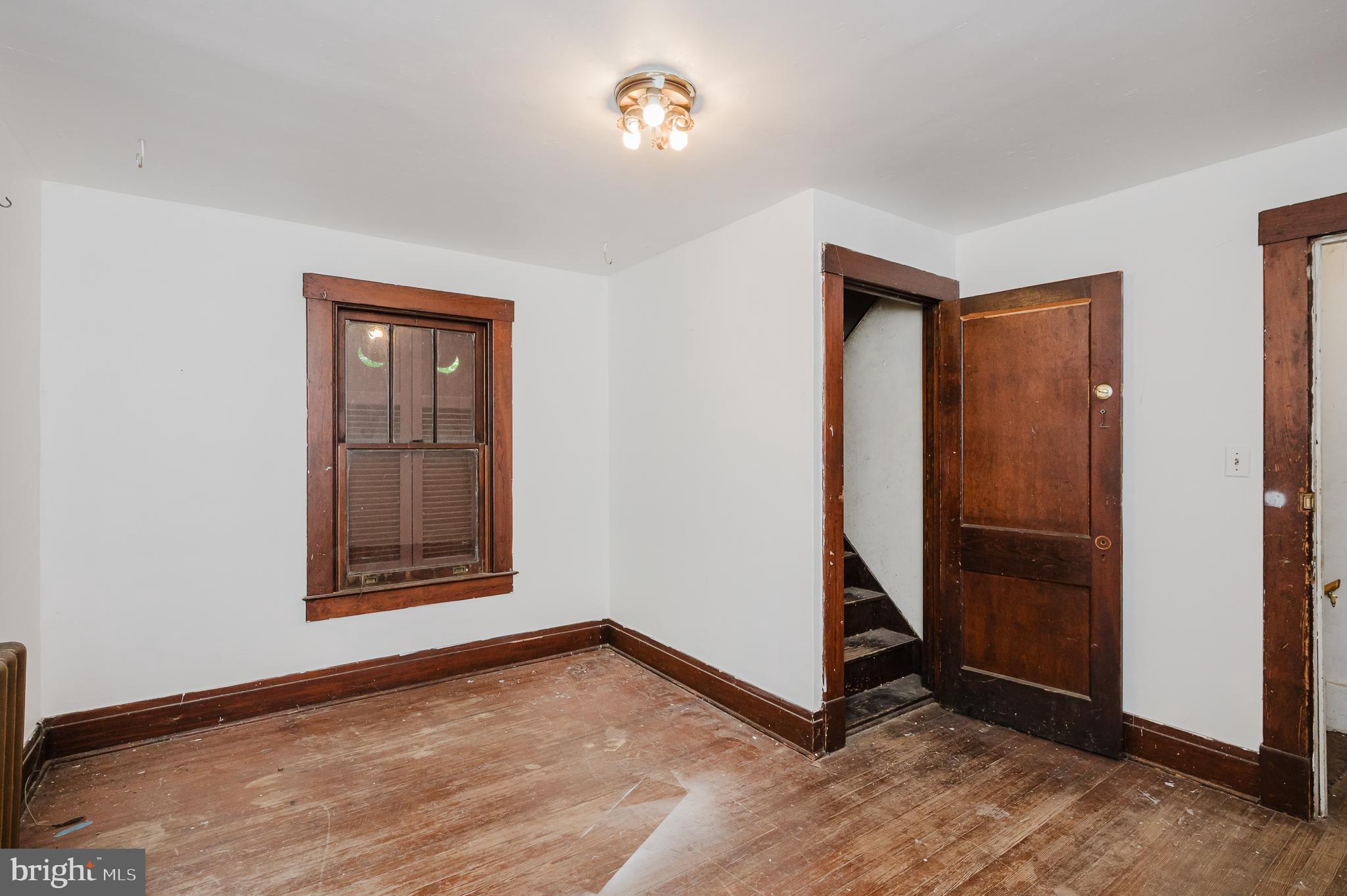 103 Sherwood Road Cockeysville, MD 21030 - Photo 36 of 59 a view of an empty room with window and hardwood floor
