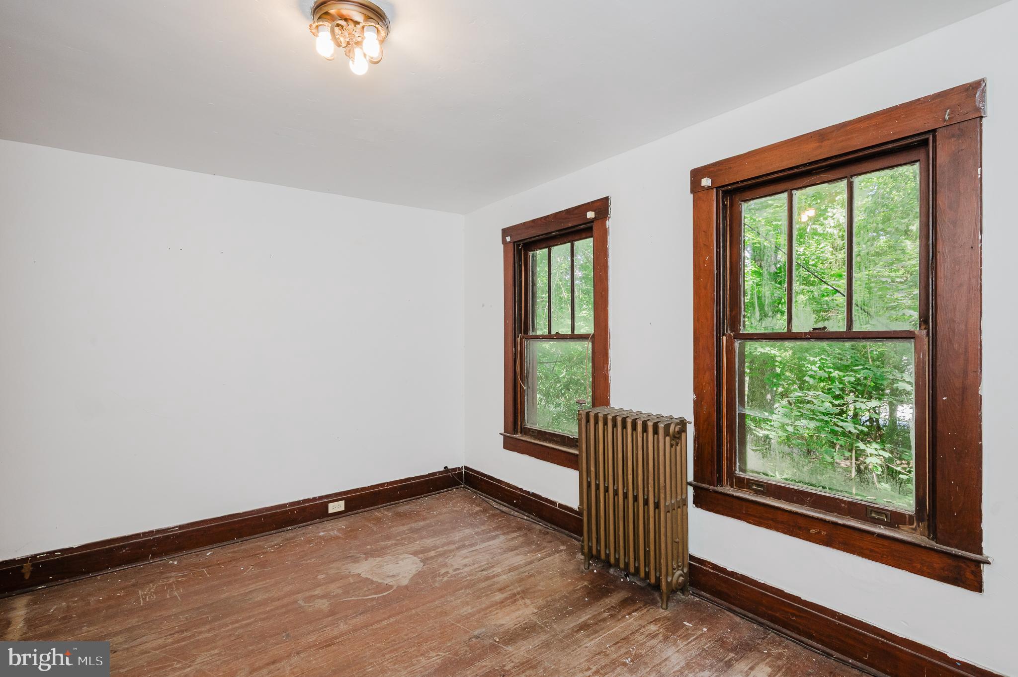 103 Sherwood Road Cockeysville, MD 21030 - Photo 38 of 59 a view of an empty room with wooden floor and a window