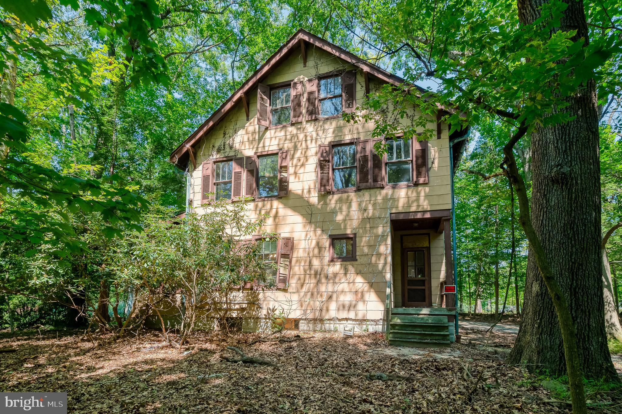 103 Sherwood Road Cockeysville, MD 21030 - Photo 52 of 59 a front view of a house with a yard and garage