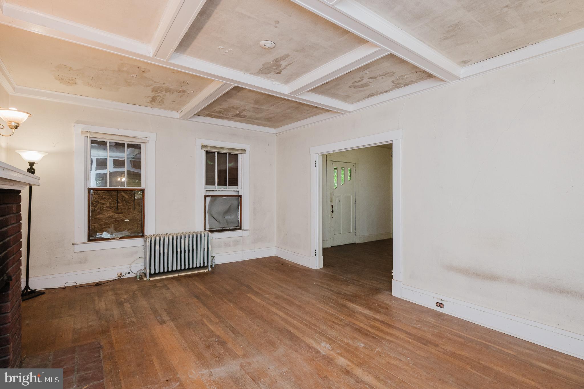 103 Sherwood Road Cockeysville, MD 21030 - Photo 8 of 59 an empty room with wooden floor and windows