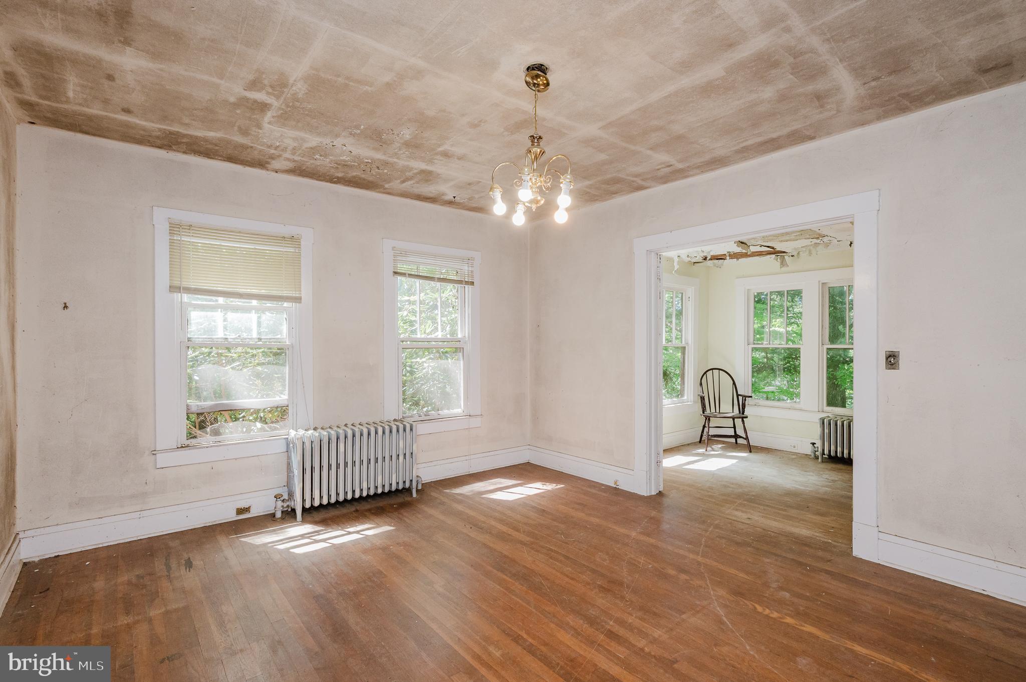 103 Sherwood Road Cockeysville, MD 21030 - Photo 10 of 59 a view of an empty room with wooden floor and a window