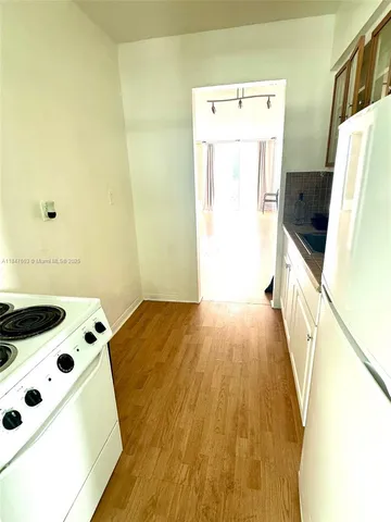 a view of walk in closet with clothes